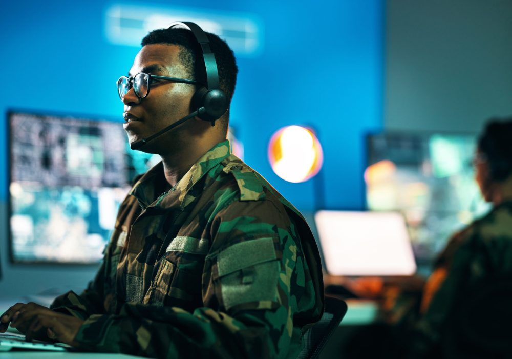 Army, control room and man on computer in office, data center and monitor for technical support, cy.